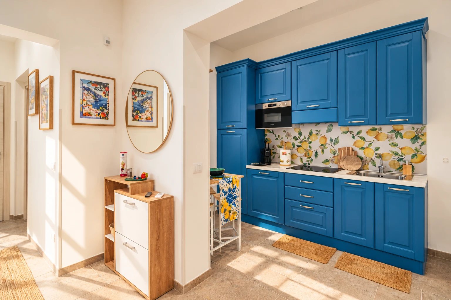 Blue kitchen with lemon tiles at Rifugio sul Mare
