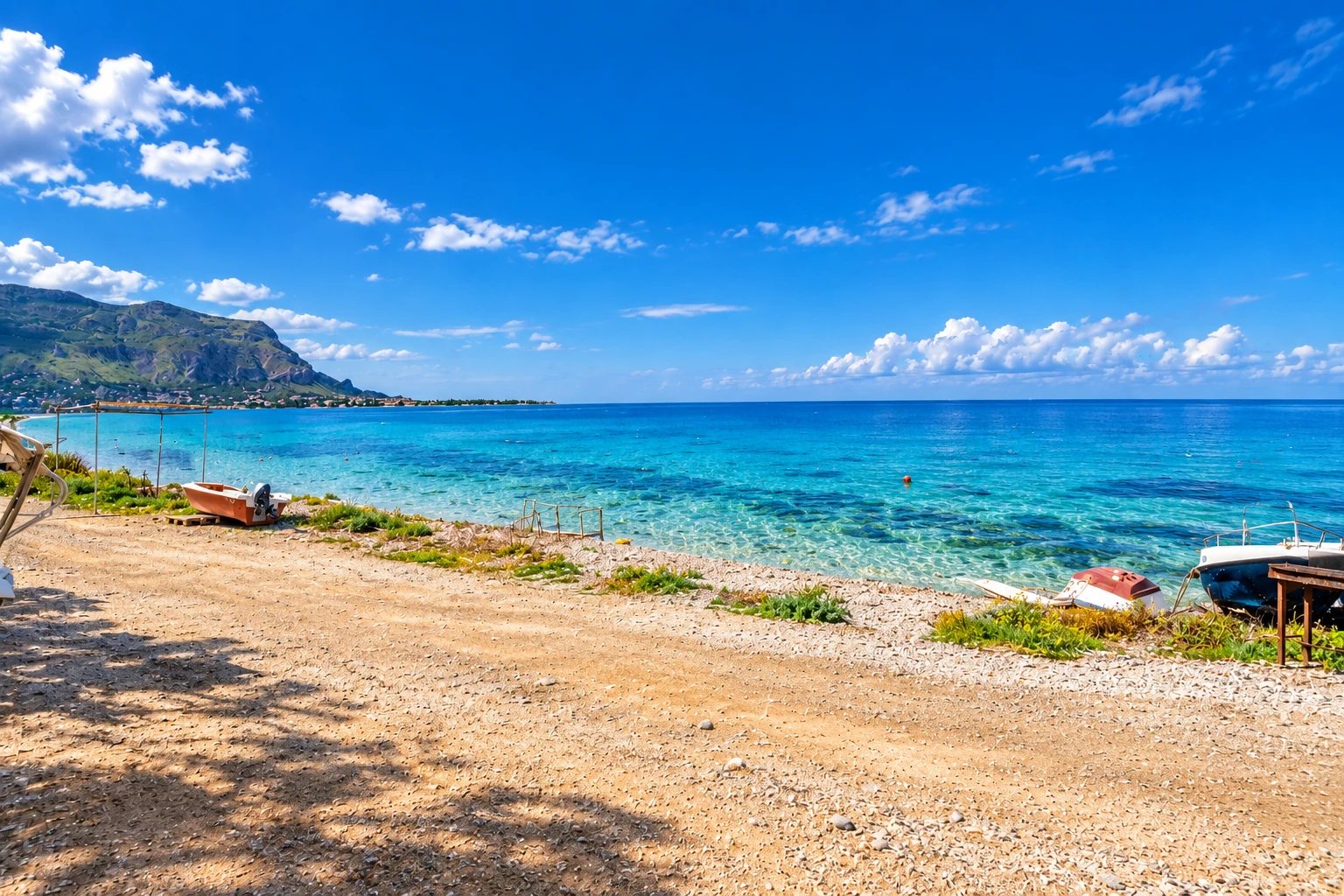 Beach and sea in front of Rifugio sul Mare on the Carini seafront